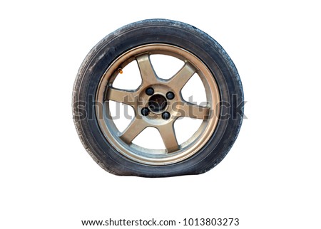 Flat tire isolated from white background. Royalty-Free Stock Photo #1013803273