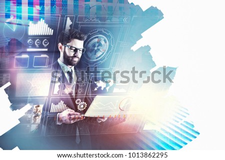 Handsome european businessman using laptop on abstract city background. Innovation and analytics concept. Double exposure 