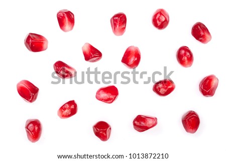 pomegranate seeds isolated on white background. Top view. Flat lay pattern Royalty-Free Stock Photo #1013872210