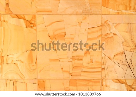 Beige stone tile in the form of wood, texture