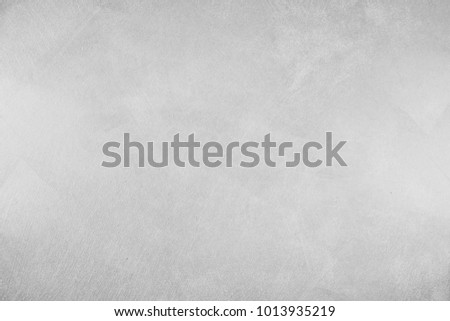 Paint (50%), texture (50%). Texture of the painted surface of a smooth rough wall. Relief plane. Balanced gray color. Light reflex. White Design Background. Artistic plaster. Rastered image.