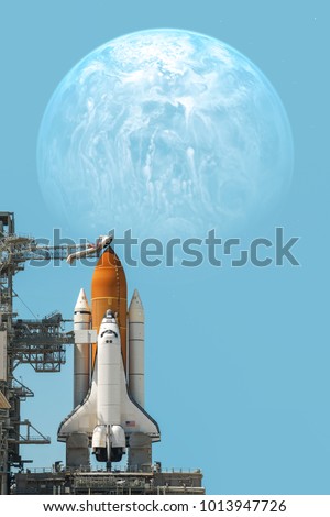 Space shuttle taking off on a mission. Elements of this image furnished by NASA. Royalty-Free Stock Photo #1013947726