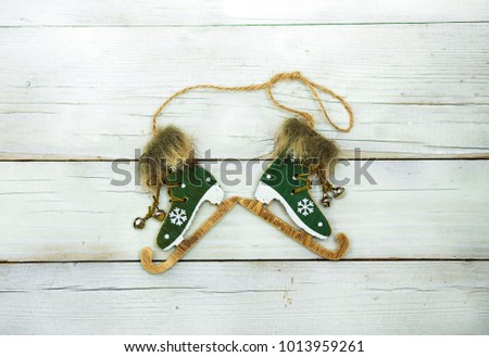 green skates on a vintage wooden background