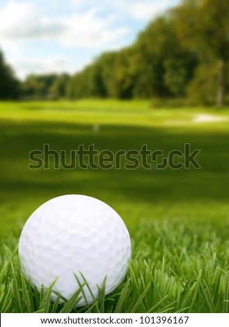 Golf Ball in Grass - Course in Background