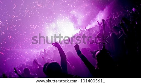 Party goers in a nightclub with co2 cannons firing Royalty-Free Stock Photo #1014005611