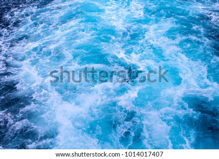 Natural surface water background. Sea ship trail with foamy wave. Tropical island cruiseliner travel. Motor boat seawater trail. Ocean top view. Big ship trail. White swirl wave in sea. Marine travel