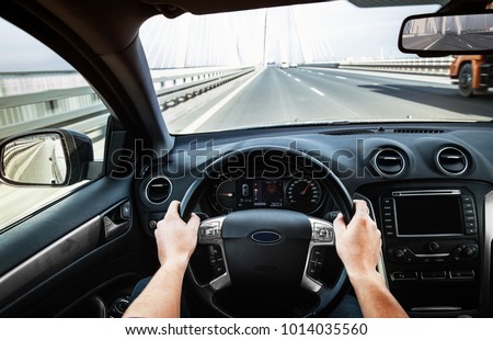 Driving car pov on a highway - Point of View, first person perspective Royalty-Free Stock Photo #1014035560