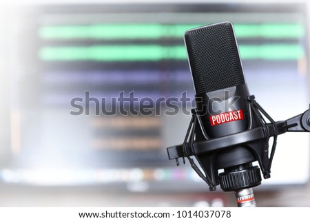 studio microphone with a podcast icon close up Royalty-Free Stock Photo #1014037078