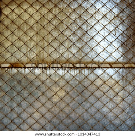 Old rusty steel mesh fence,old steel grating texture,pattern and background