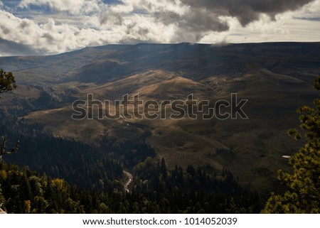 Mountain river flows through the valley        