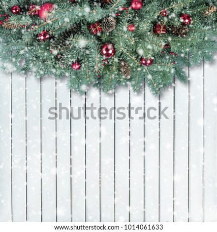 Christmas firtree on white wooden background