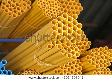 Stacks yellow circle pipes with hollow