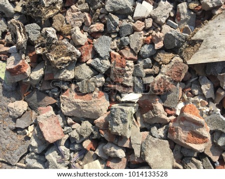 many broken bricks are on the ground