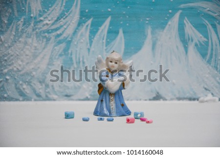 White-blue angel on winter background painting