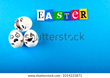 Easter inscription and eggs with different funny faces on blue background.
