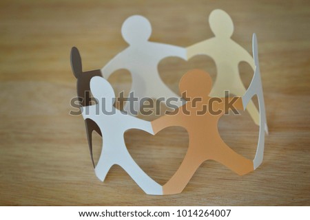 Paper people in a circle holding hands - Anti-racism and love concept Royalty-Free Stock Photo #1014264007