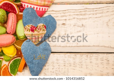 assorted chocolates arranged on a background for greeting card , site header, concept sweet celebration of love
