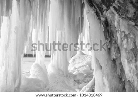 Sun shines on an ice column curtain on Grand Island near Munising Michigan in winter