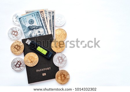 Black passport, white background, identity confirmation. US dollars USD metal coins gold silver bitcoin, crypto currency, identification. Memory card USB stick purse. Security code cold wallet.
