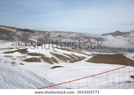 Snowy mountains and clouds