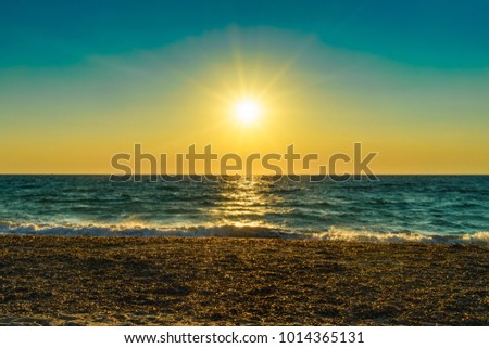 Sunset on the sea, coast of Lefkada, Milos beach.