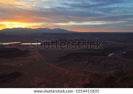 Sunrise behind the La Sal mountains from Dead Horse Point, Utah, USA.