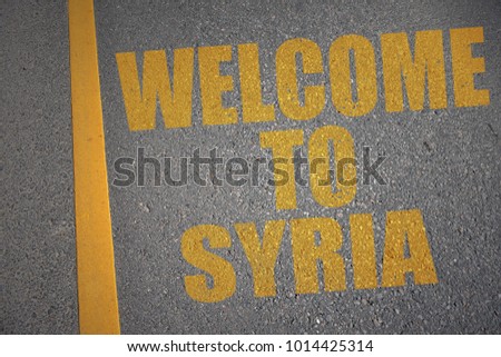 asphalt road with text welcome to syria near yellow line. concept