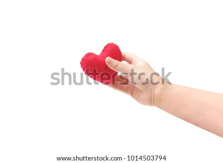 Baby's hand holding a red heart isolated on white background                              