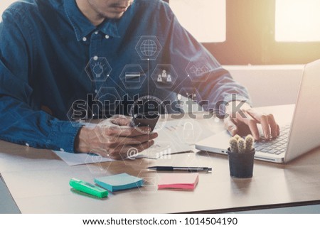 Businessman hand using smart phone,laptop, online banking payment communication network with virtual graphic icon diagram.Close up