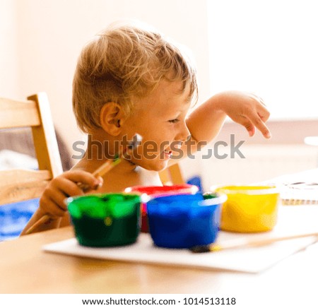 little cute boy painting at home, lifestyle people concept