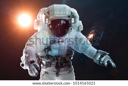 Astronaut in deep space. Symbol of space exploration. Elements of this image furnished by NASA