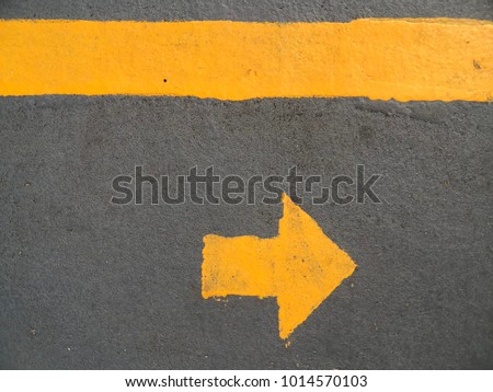 asphalt road yellow making. Direction arrow. Bangkok, Thailand.