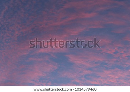 Fantasy pastel blue sky and red clouds in evening
