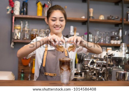 Asian Barista woman making Coffee with coffee machine in the coffee shop. people with barista in cafe concept.