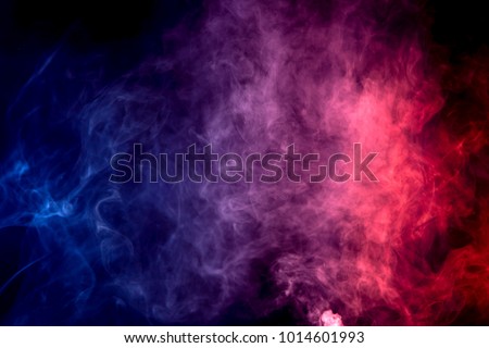 Colorful  purple and blue smoke clouds on dark background