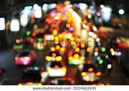 Colorful Bokeh from light bulbs to cars on the road.
