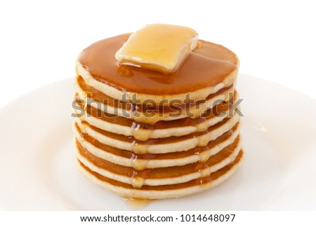 Stack of Pancakes with maple syrup and butter on a plate isolated white background. Shrove Tuesday. Food. Family Breakfast. Brunch. Dessert. Snacks. Royalty-Free Stock Photo #1014648097