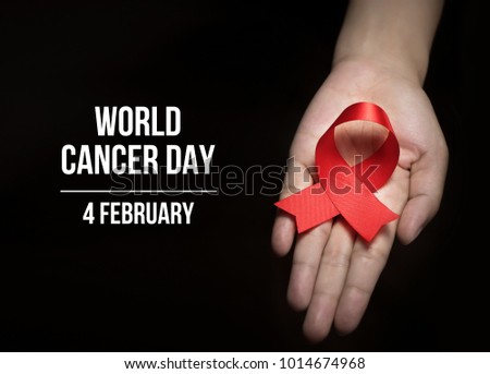 4 February , World Cancer Day with ribbon on human hand for campaign poster about cancer