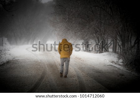 the man who is in the road that is snow