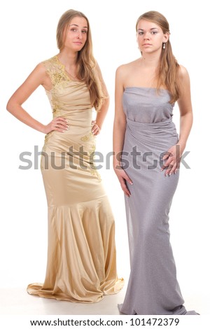 Envy of her friends - two friends in the gold and silver dress on a white background