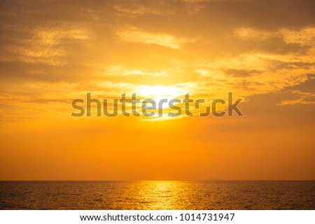 Beautiful sunset on the beach and sea - Vintage Filter Royalty-Free Stock Photo #1014731947