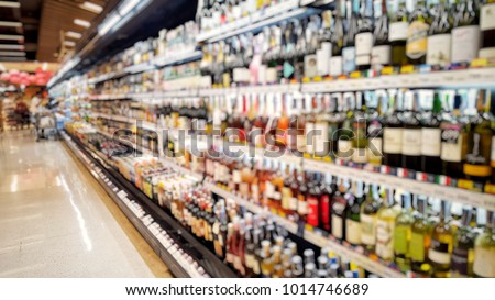 Blurred picture of liquid shelf in supermarket store for background.