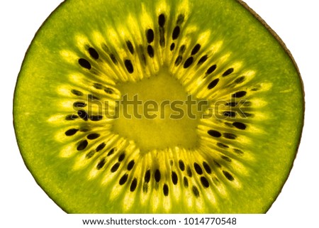 Texture of cut kiwi through which light passes, macro, close-up