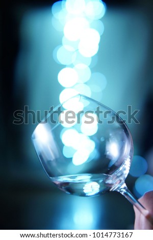 holding wine glass with bokeh background 