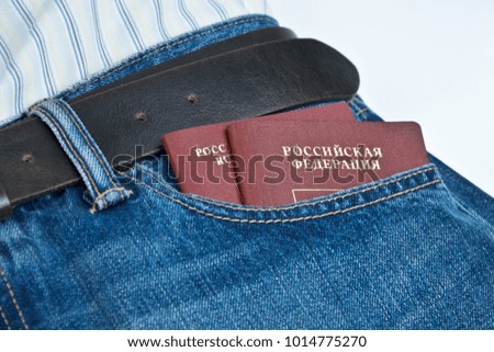two russian passports in jeans pocket