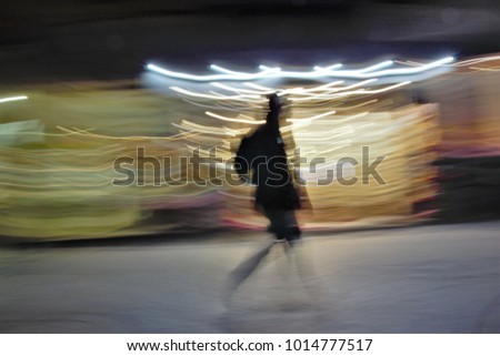 Shopping, Impressionist night photography of people taken at low speed, in a commercial street, with lights, ghostly shadows, panoramic, blurred background, motion sensation, semi-brutish people,