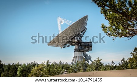 A huge soviet radio telescope near abandoned military town Irbene in Latvia Royalty-Free Stock Photo #1014791455
