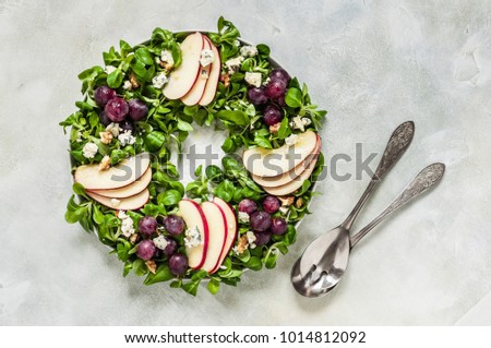 Christmas Wreath Salad: Spinach and Corn Salad, Apple, Blue Cheese, Grapes and Honey Dressing, copy space for your text