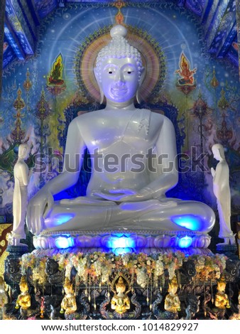 White buddha with blue background
