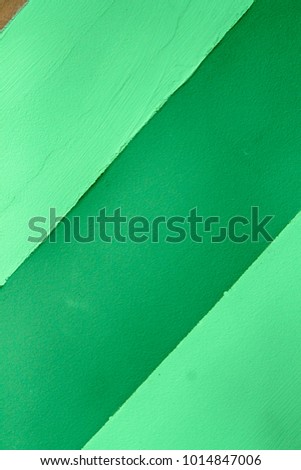 Wall with Green lines, detail of decoration in the city, textured background.